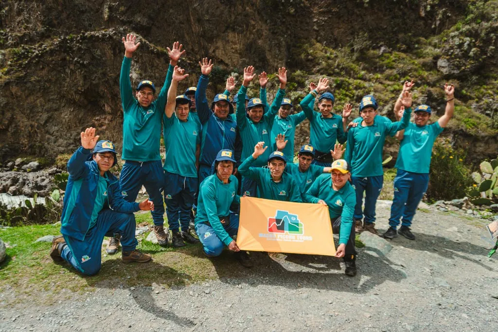 Inca Trail Porters at km 82 with the Machu Picchu Tours logo